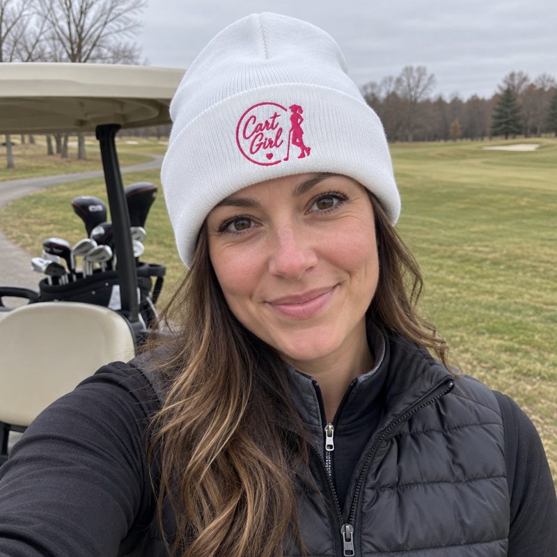 A golfer wearing Cart Girl Half Circle Logo - Beanie on the course