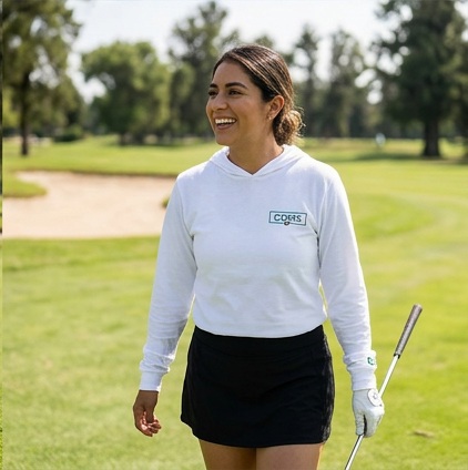 A golfer wearing CDMX | Hooded Long Sleeve Tee Sweater on the course