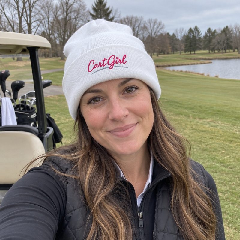 A golfer wearing Cart Girl Cursive Logo - Beanie on the course