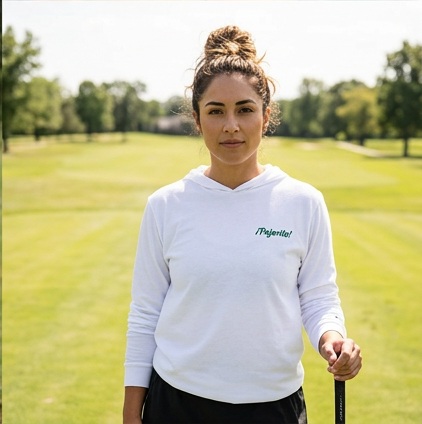 A golfer wearing Pajarito | Hooded Long Sleeve Tee Sweater on the course