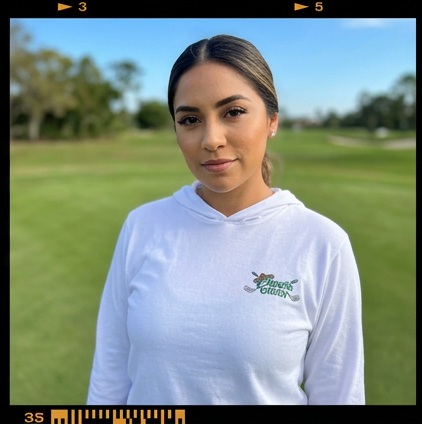 A golfer wearing Chingon on the Gren | Hooded Long Sleeve Tee Sweater on the course