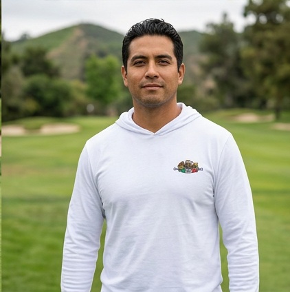A golfer wearing Mexican Eagle DJ Golfer | Hooded Long Sleeve Tee Sweater on the course