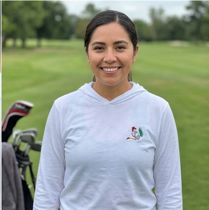 A golfer wearing Rooster Flag | Hooded Long Sleeve Tee Sweater on the course