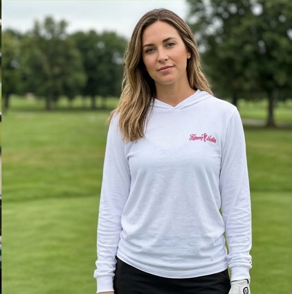 A golfer wearing Fairway Ladies | Hooded Long Sleeve Tee Sweater on the course