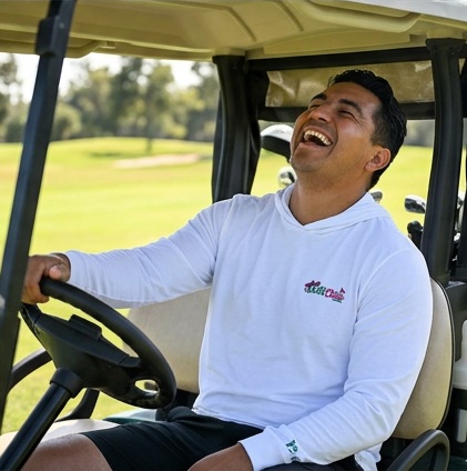 Golf & Chisme | Hooded Long Sleeve Tee Sweater in a golf lifestyle photo 5